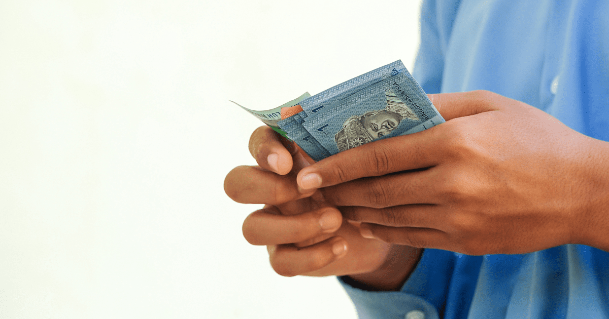 ringgit notes in hand