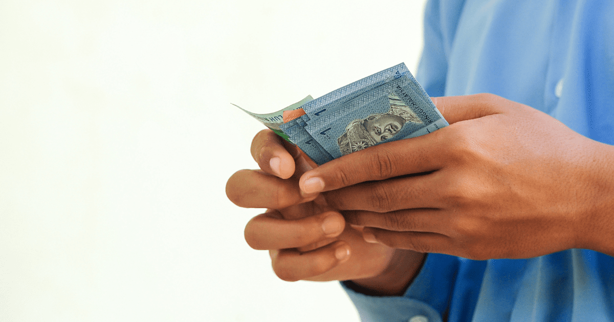ringgit notes in hand