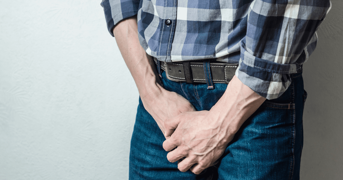 man cover his crotch 