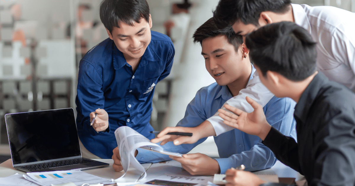 Bunch of asian men working together