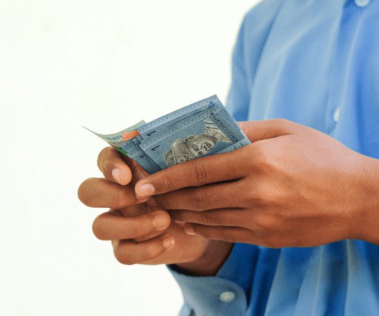 ringgit notes in hand