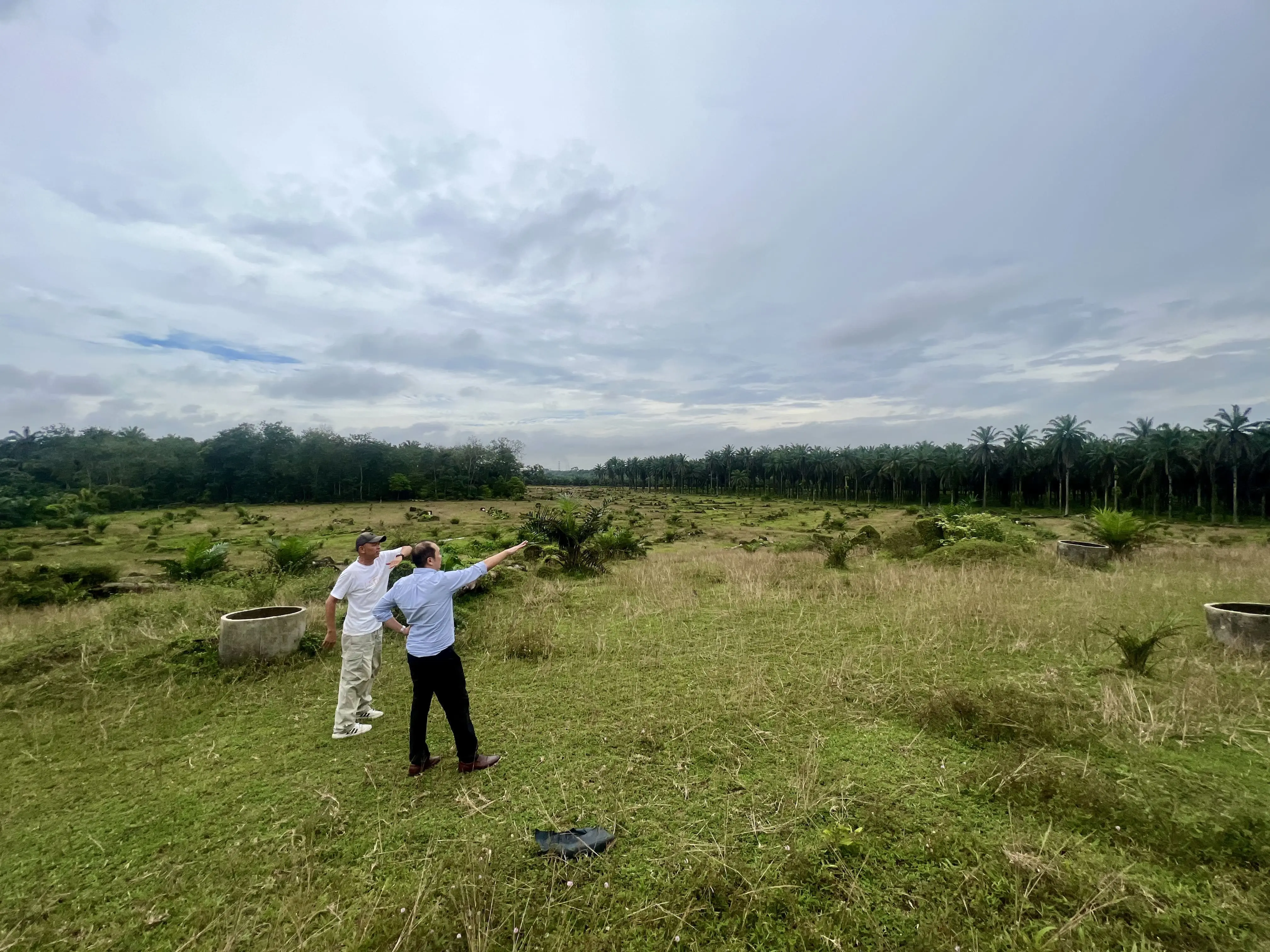 LK02-Tan and his associate overlooking the land for upcoming CFE farms
