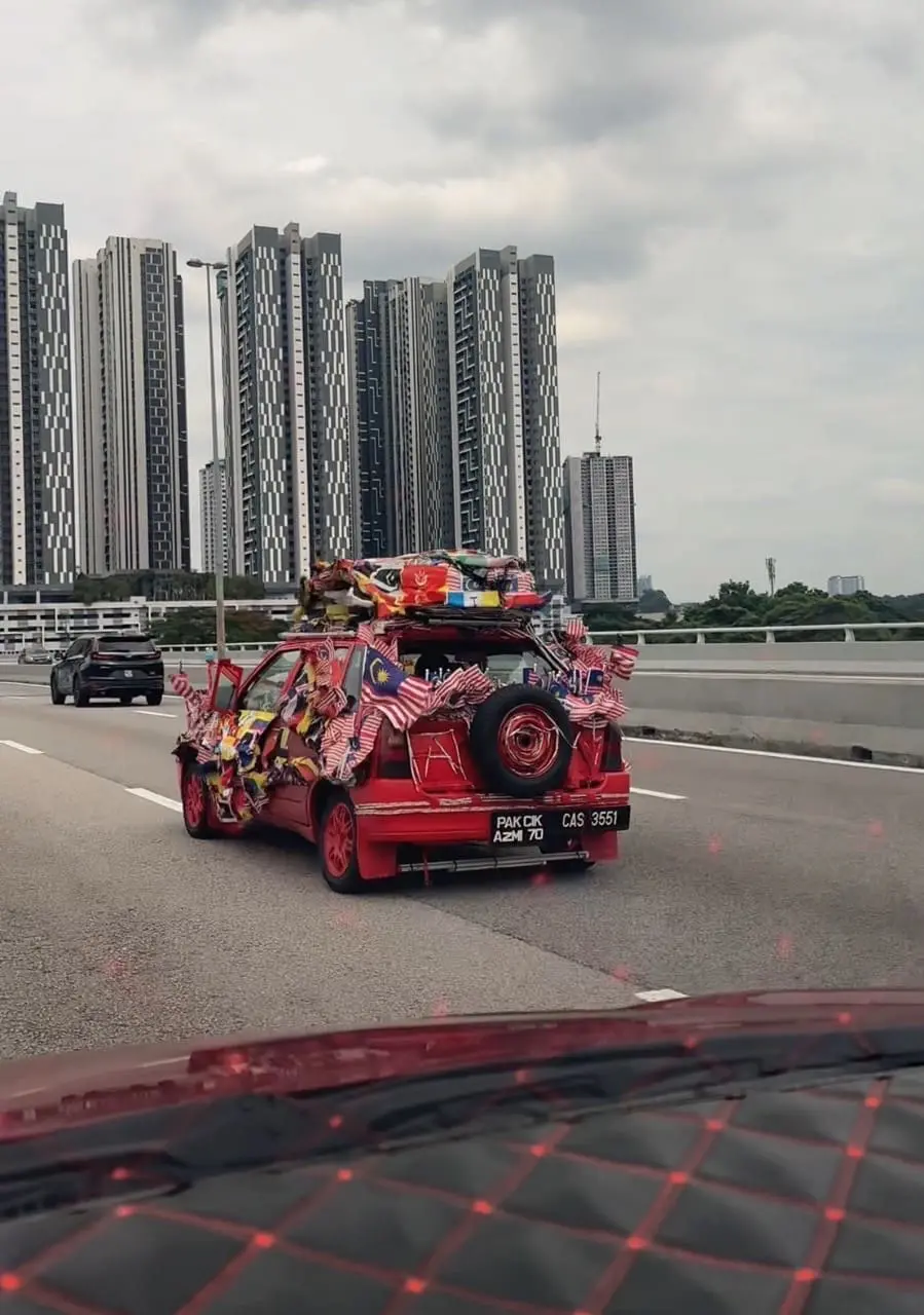 Car covered with flags