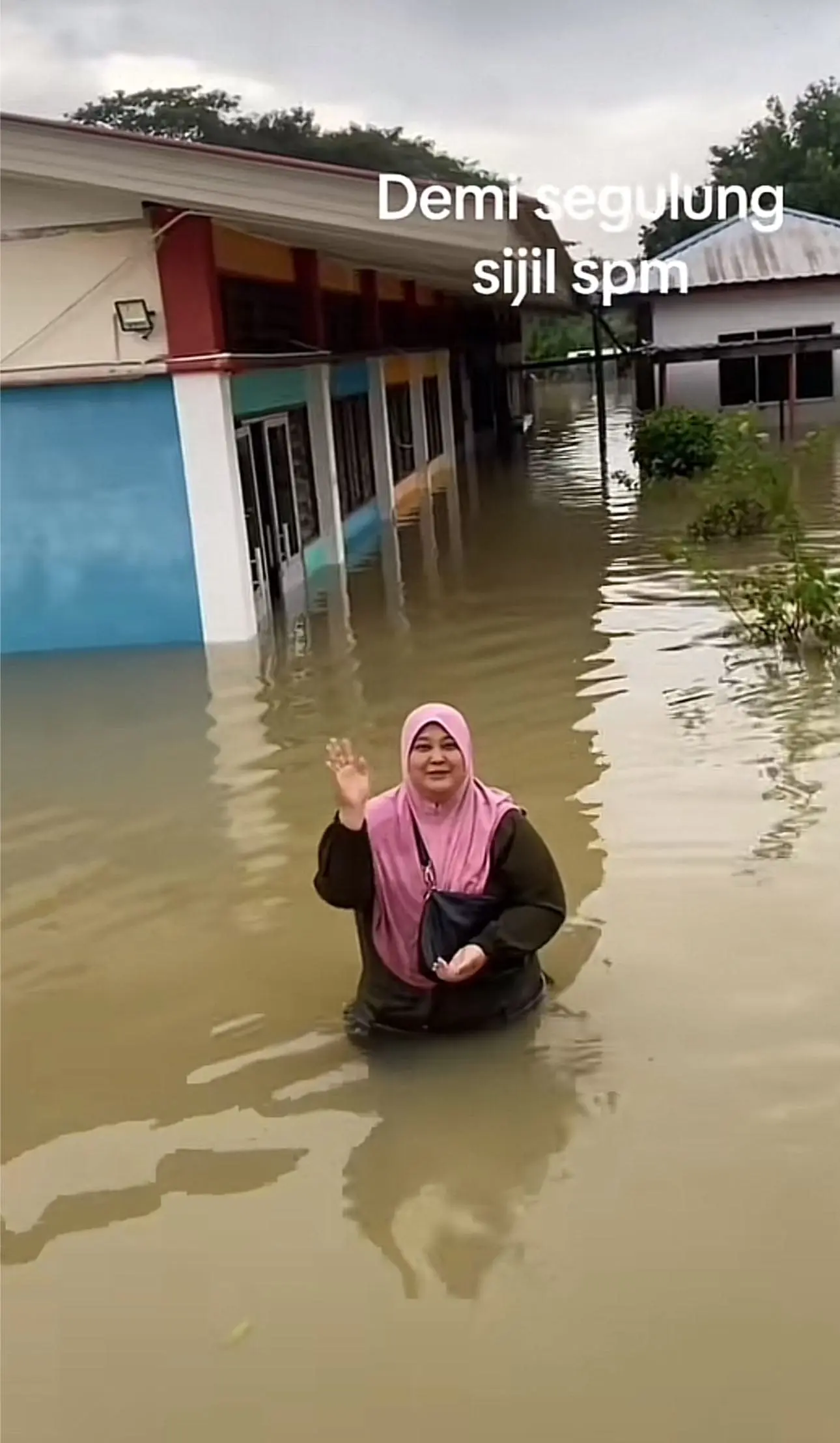 SPM student's mom waving at her