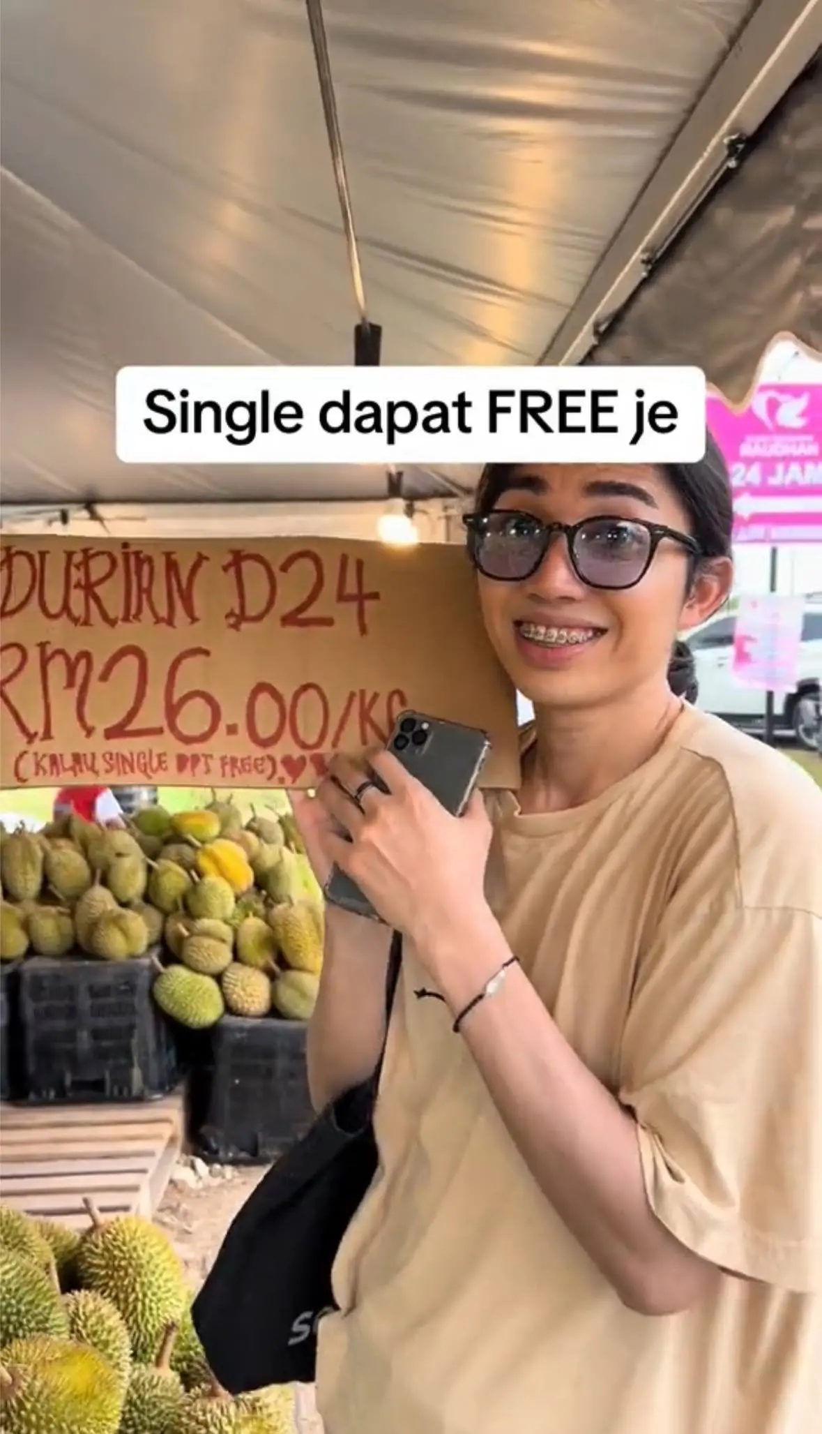malaysian showing the durian pricing cardboard