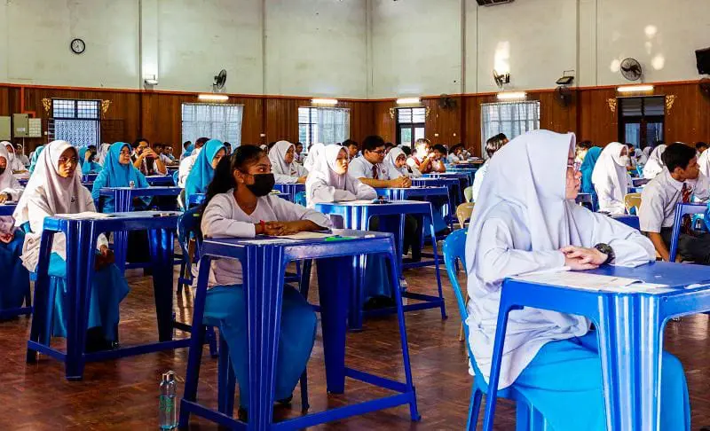 malaysian students sitting for spm in a hall