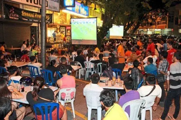 M'sians watching football match at mamak