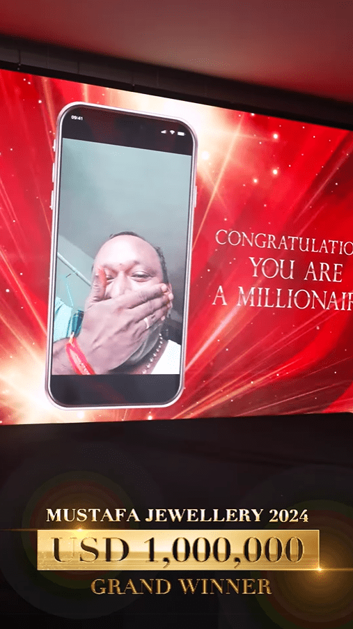 Man announced the winner of lucky draw event in Singapore
