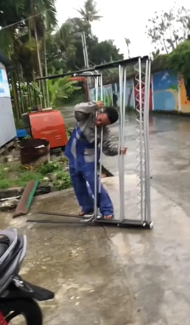 man asking for help after his head got stuck in clothe hanger