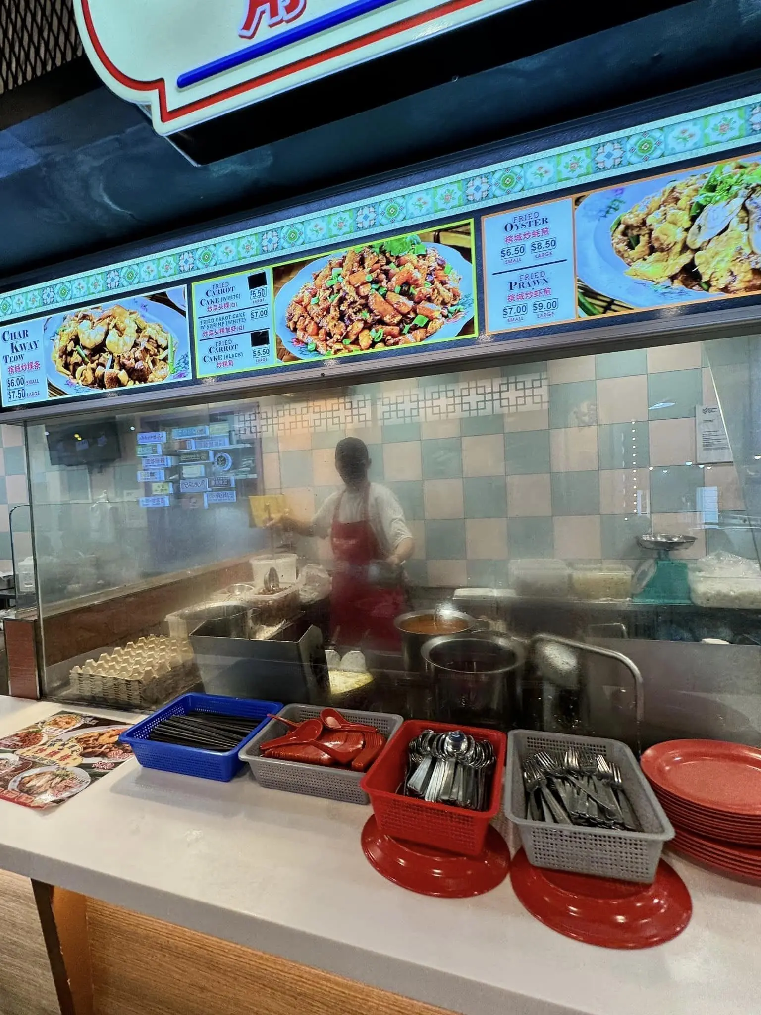 Man at CKT stall in Bugis