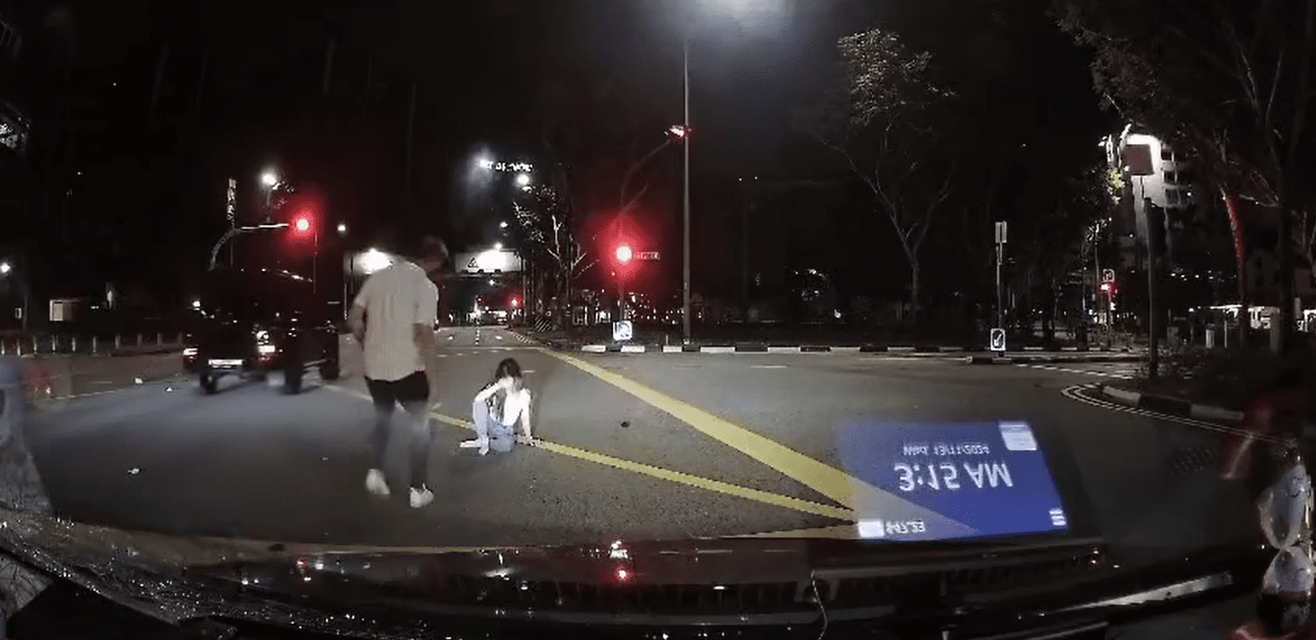 Man checks on jaywalking woman who got hit