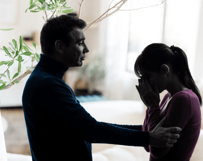 man consoling a woman