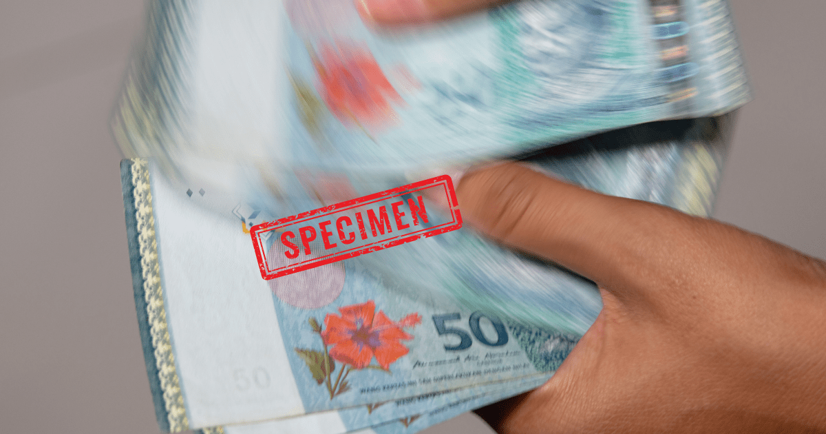 man counting ringgit