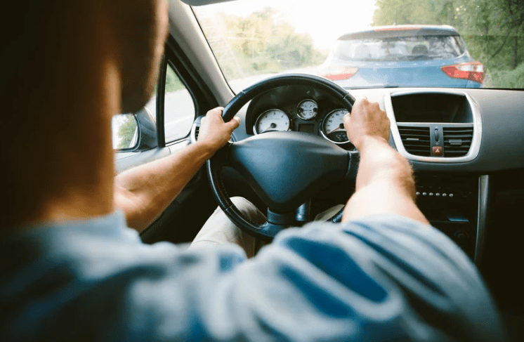 Man driving a car