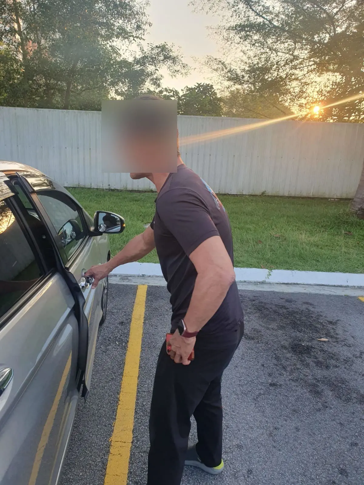 man enteriman entering his carng his car