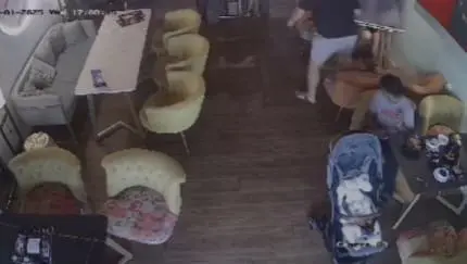 man flipping the tabel in a restaurant