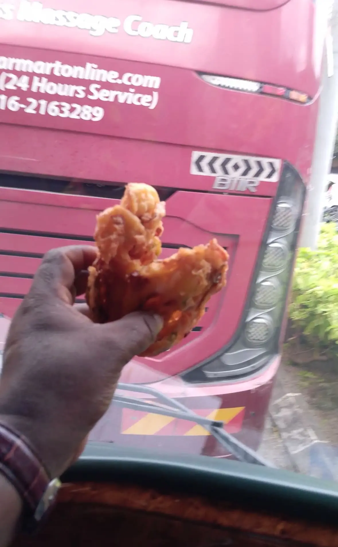 Man holds 2 fritters