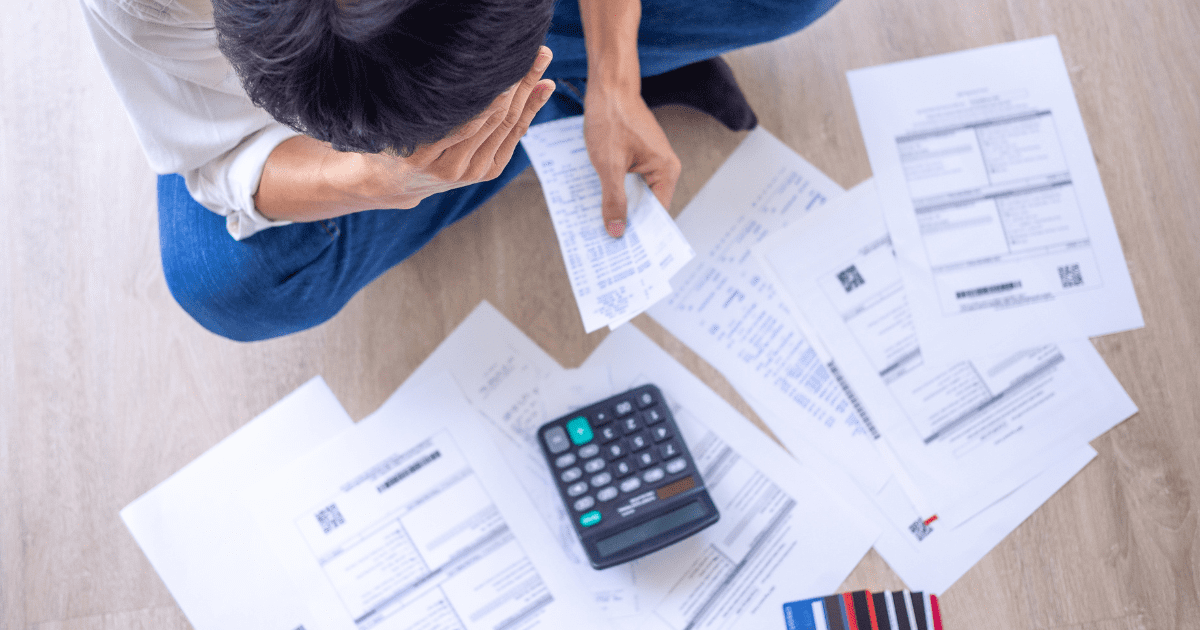 man is calculating his bills