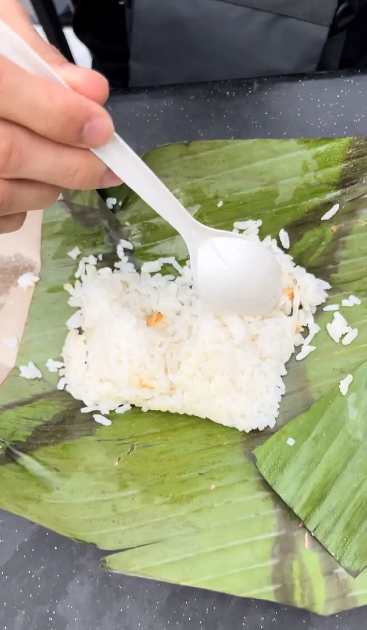 man is eating plain white rice with spoon
