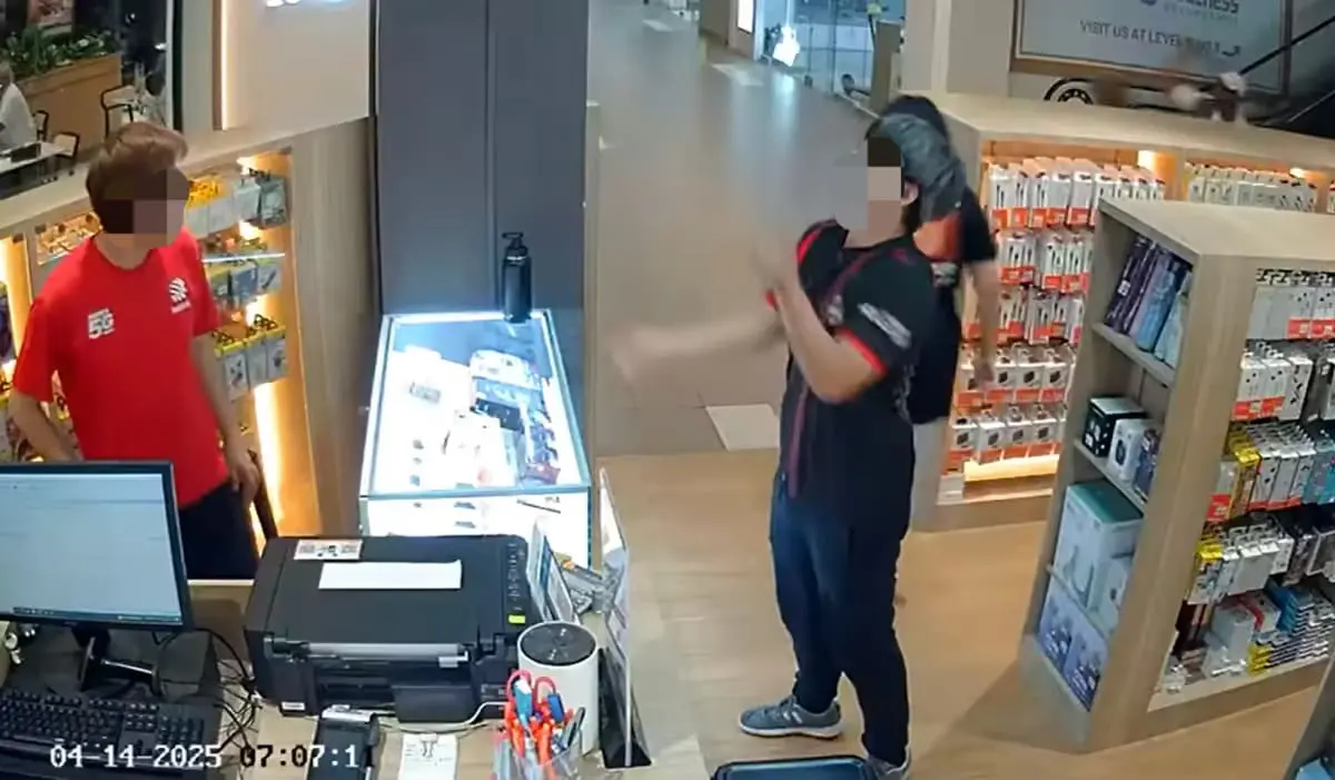 Man juggling in front of colleague