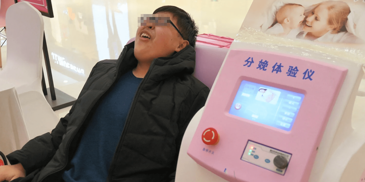 Man on childbirth simulator