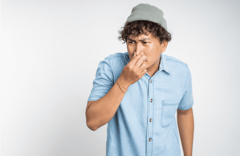 Man pinching his nose