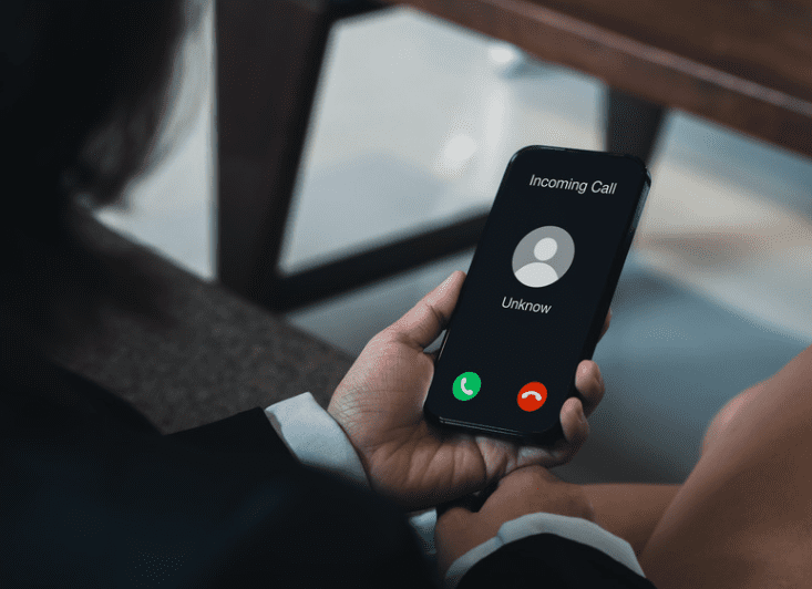 man receiving a spam call