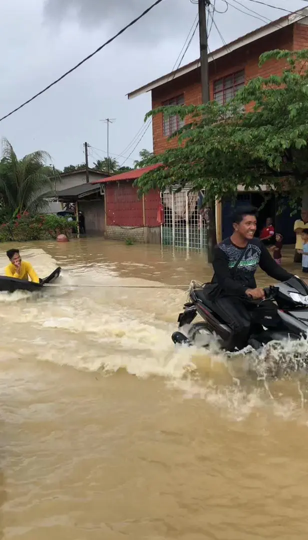 man riding on self-made banana boat