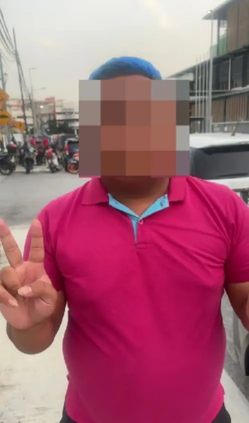 man showing peace sign