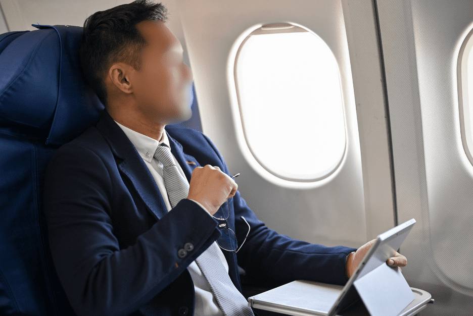 man smiles on airpane