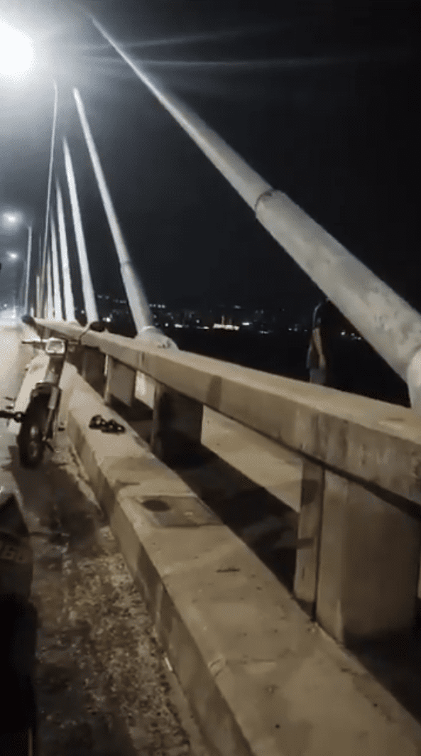 Man stands on the edge of the Penang Bridge