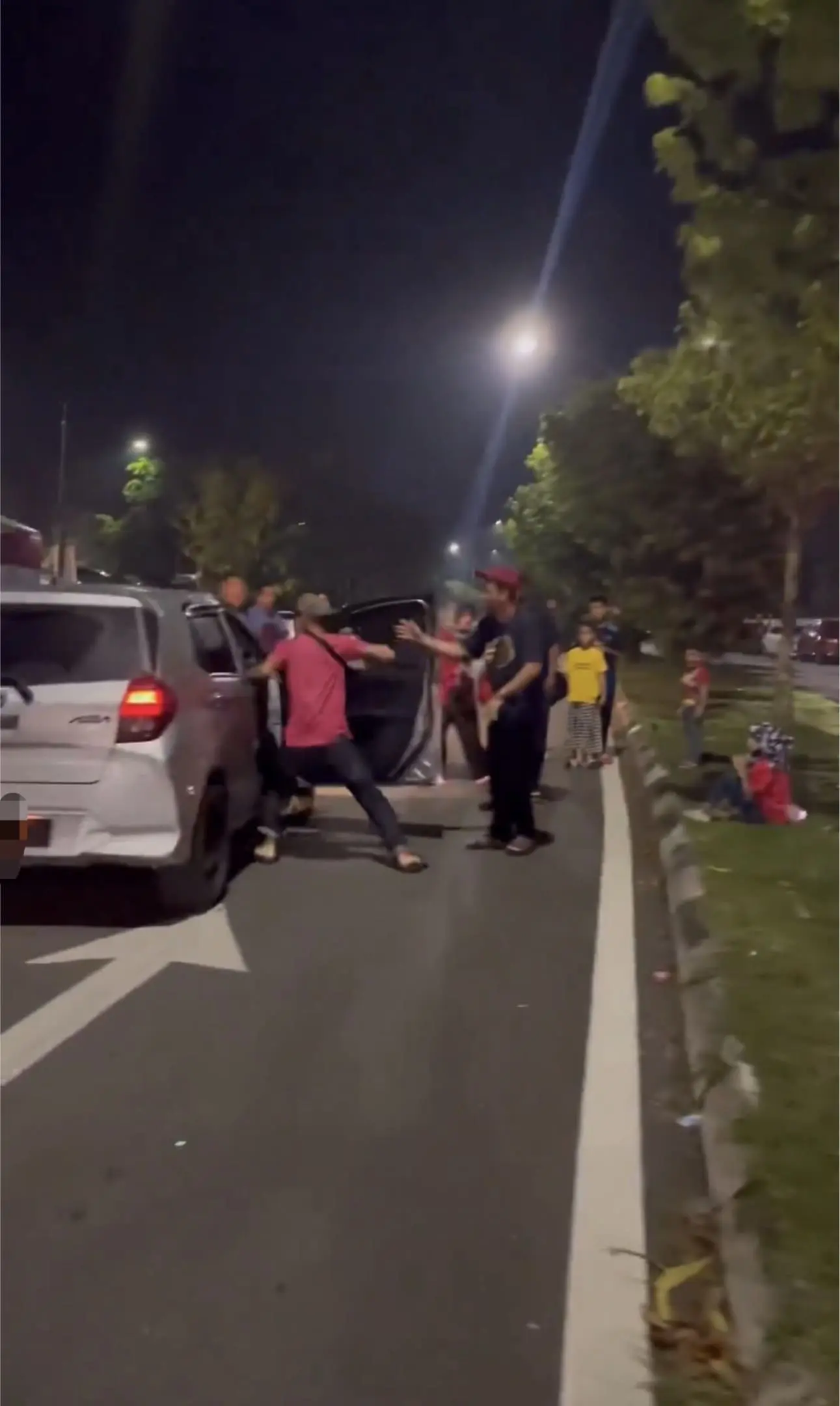 Man throwing a hard punch at the driver once again