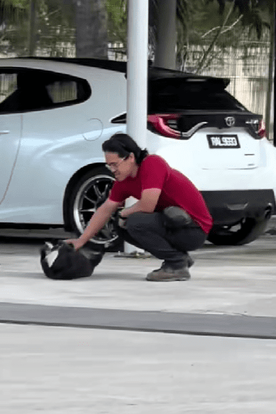 man trying to coax sulky dog