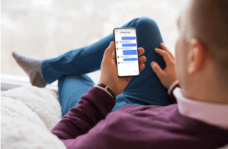 Man using Facebook on his phone