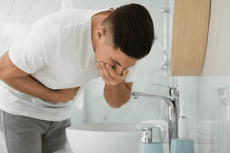 Man vomiting in the bathroom