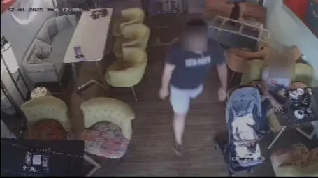 man walking away after flipping the table in a restaurant