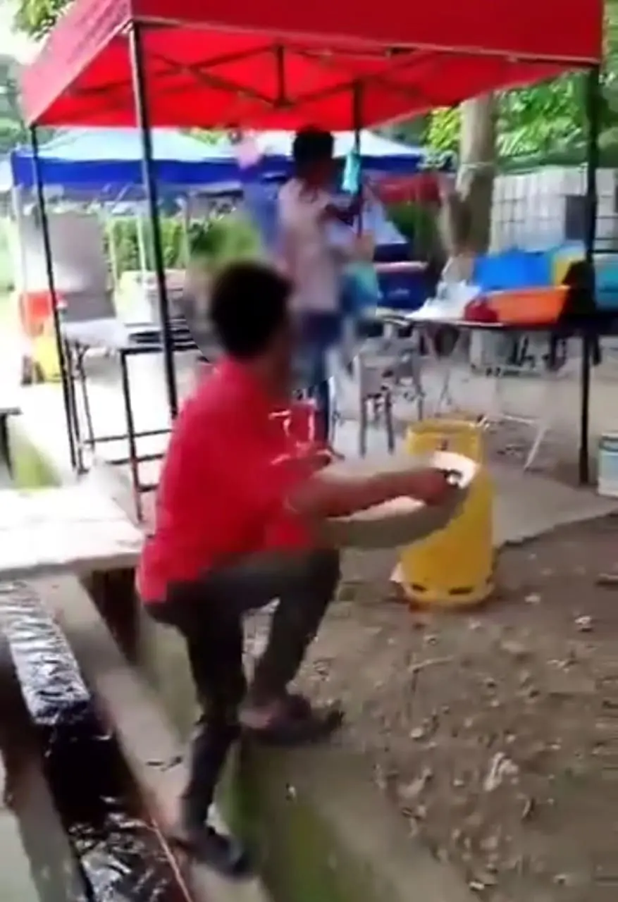 man walking out of the drain