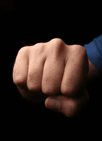 Man's hand curled into a fist