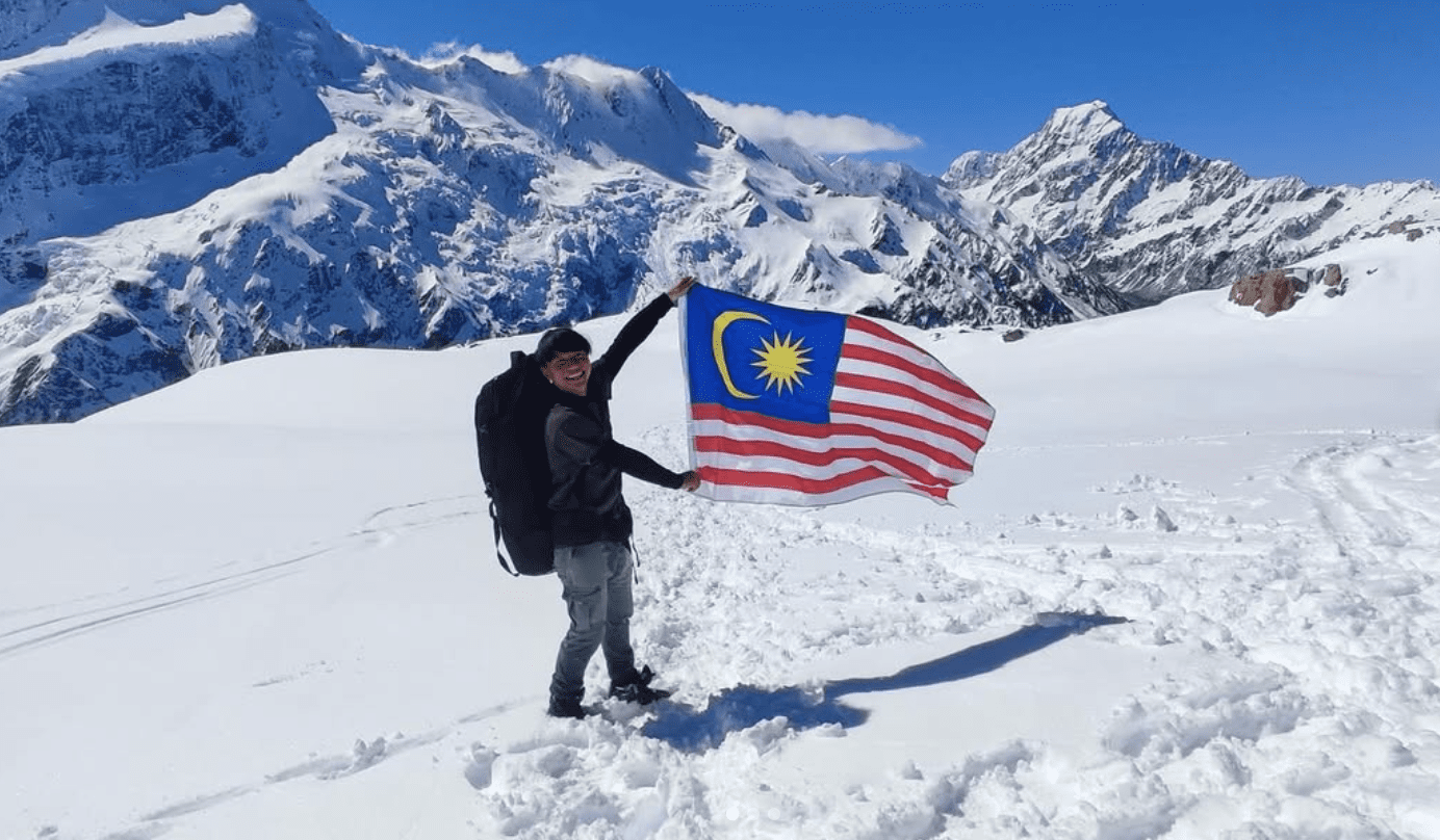 Matthew holding the M'sian flag