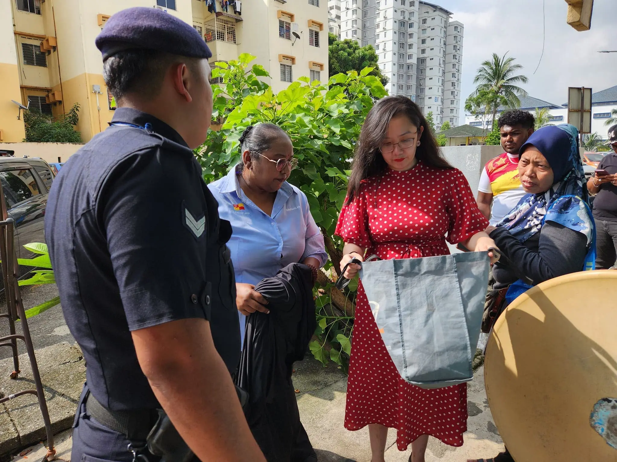 Subang Jaya ADUN Michelle Ng holds bag containing baby's items