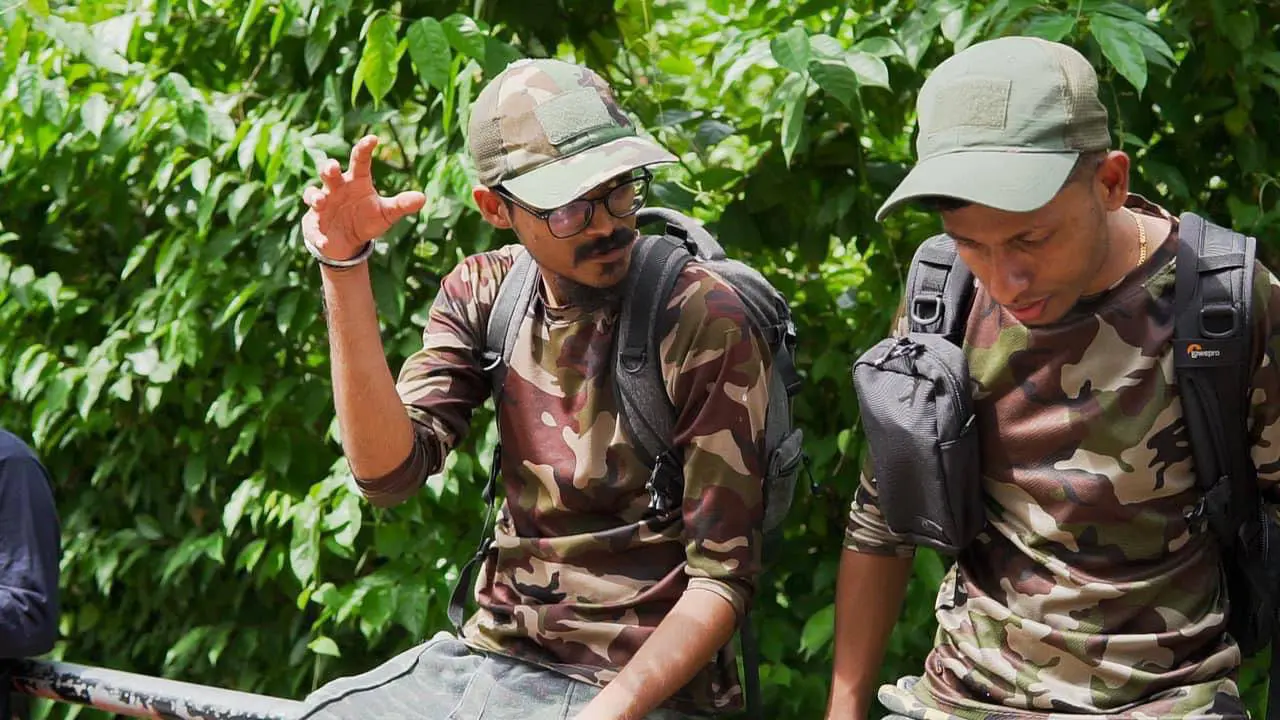 Mohan and his fellow wildlife photographer at a safari talking about a shoot