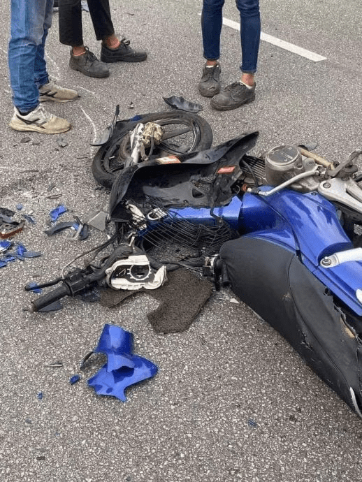 Damaged motorcycle of M'sian dad who died saving his daughter