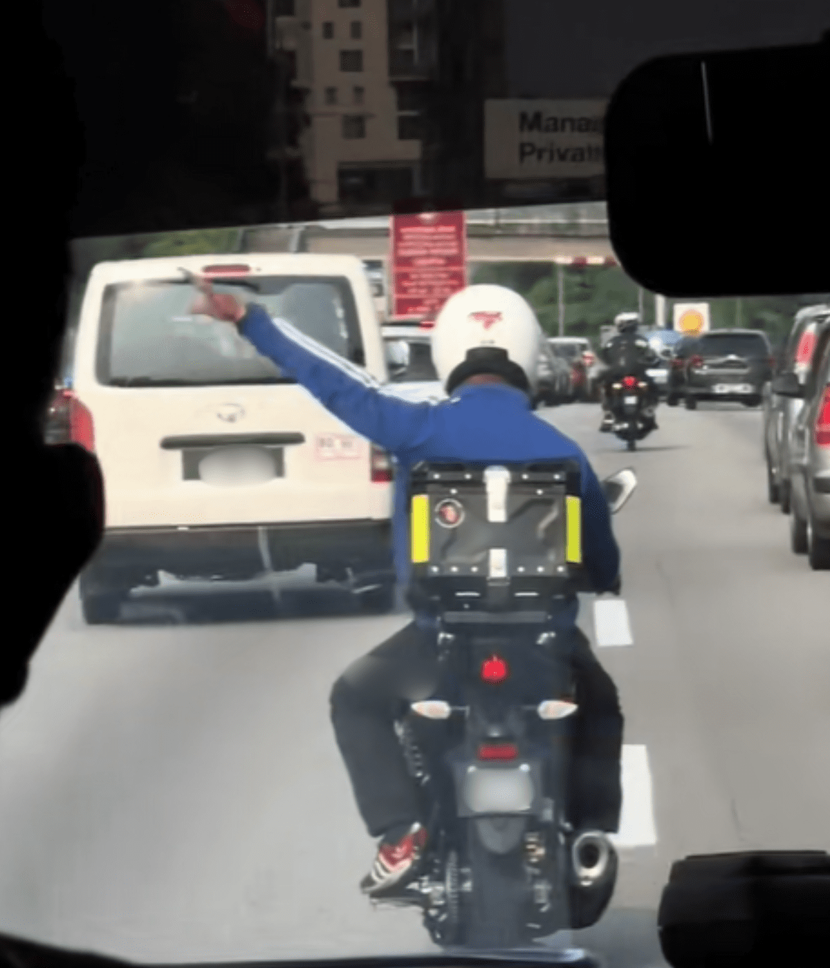 motorcyclist help clear path for ambulance