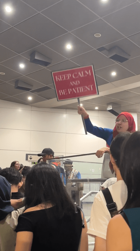 mrt staff fanning the crowd at trx station