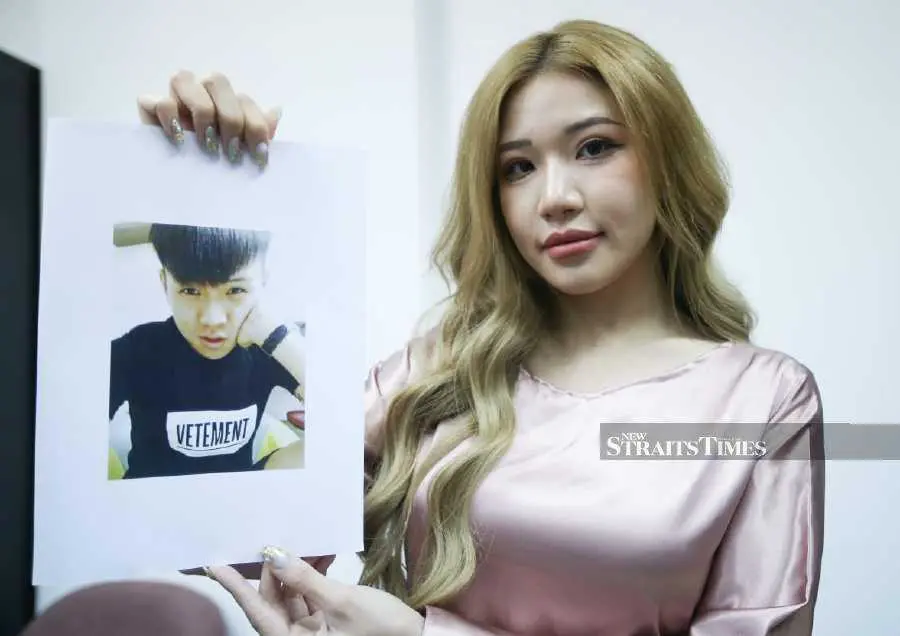 Ms PuiYi shows Lai's photo