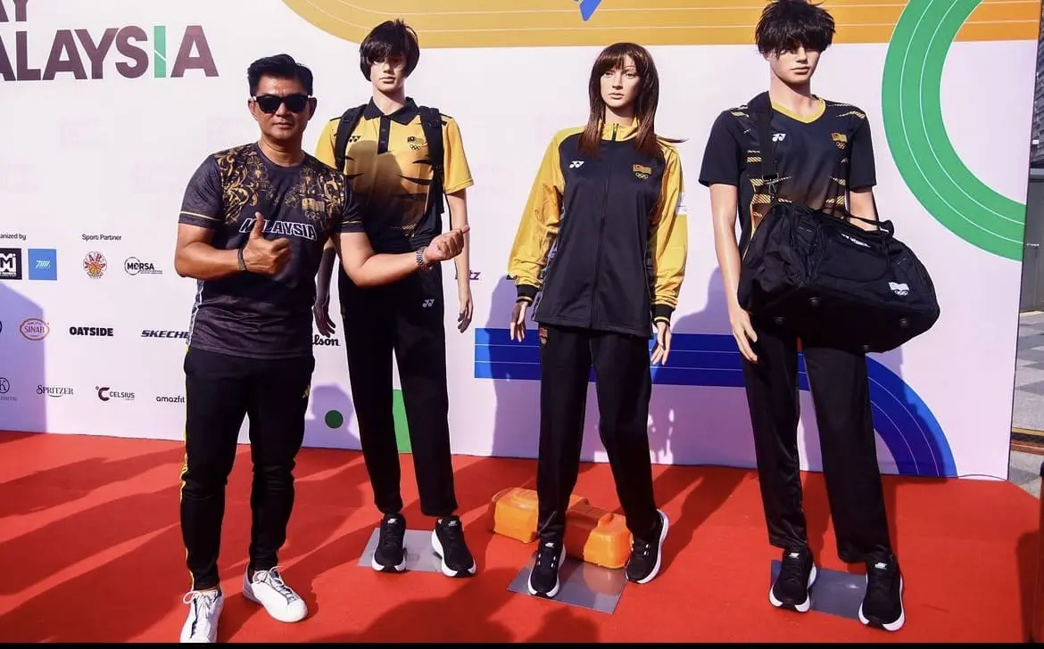 M'sian athlete posing with Olympics attire