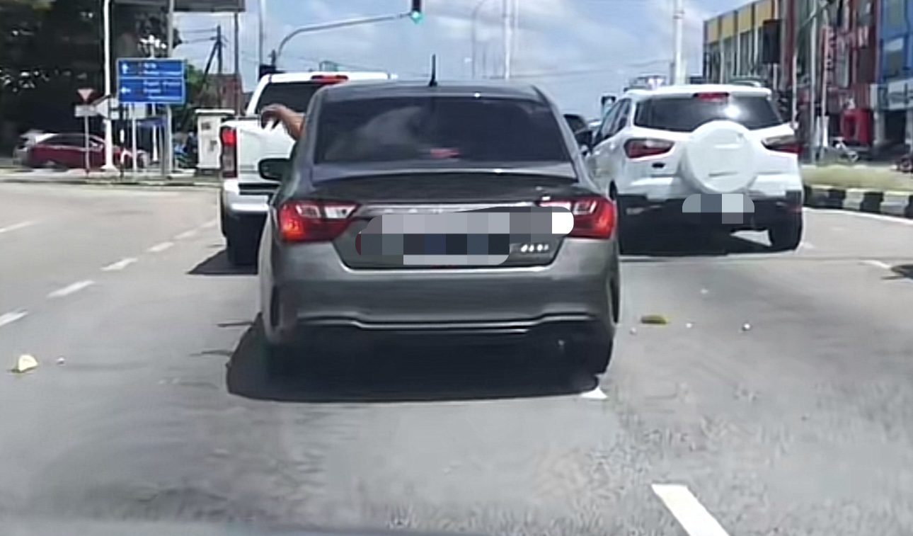 M'sian Caught Dumping Durian Skins Onto Road From Car Window In Kelantan