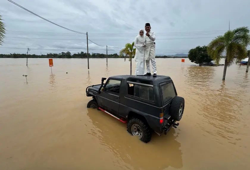 M'sian couple poses on top of 4-wheel vehicle