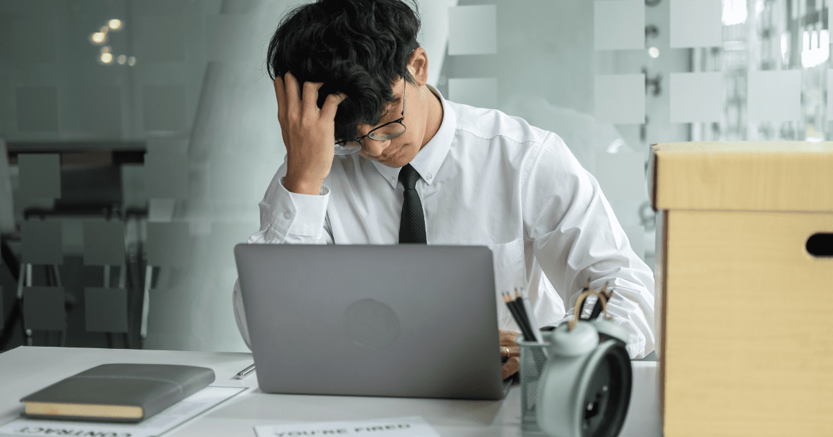 msian employee looking stressed after being fired