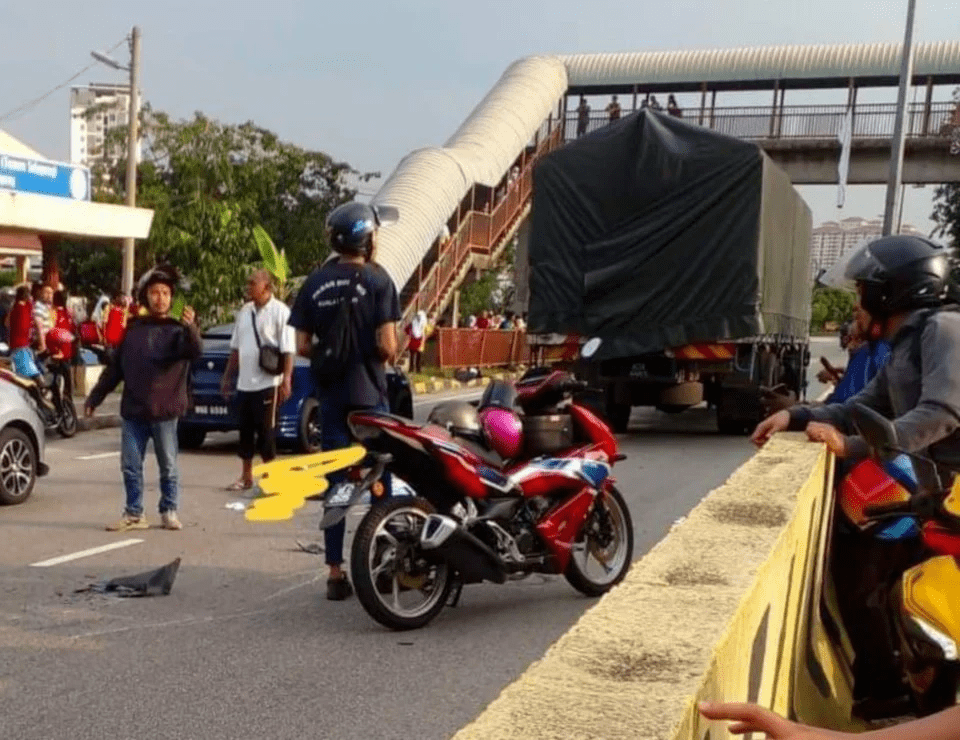 Witnesses at the accident scene in Gombak
